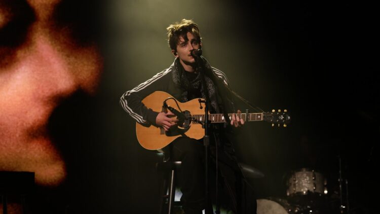 Watch Timothée Chalamet Carry out Bob Dylan Songs on Saturday Night time Stay
