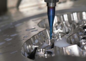 What does CNC imply in manufacturing