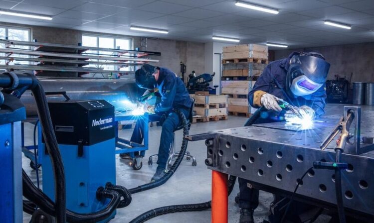 Cell fume extractor provides dual-workstation functionality
