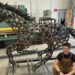 A highschool welding scholar brings a 500-horseshoe sculpture to life