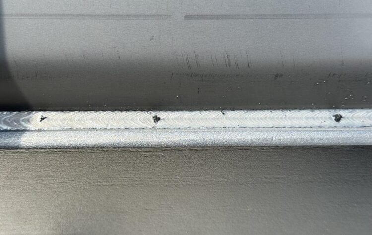 Silica islands on stainless-steel welds